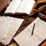 3 books with notes and and writing on them.